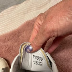 Never worn ever adidas unique sneakers in a color silver color